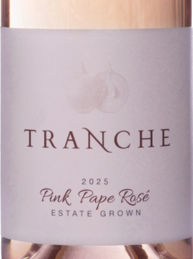 Wine bottle with 'Tranche' label on a light background